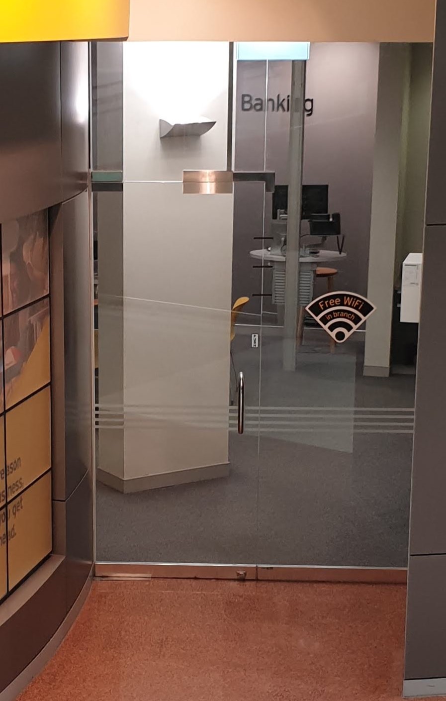 Surface installation of the lock and strike on a swing through glass door