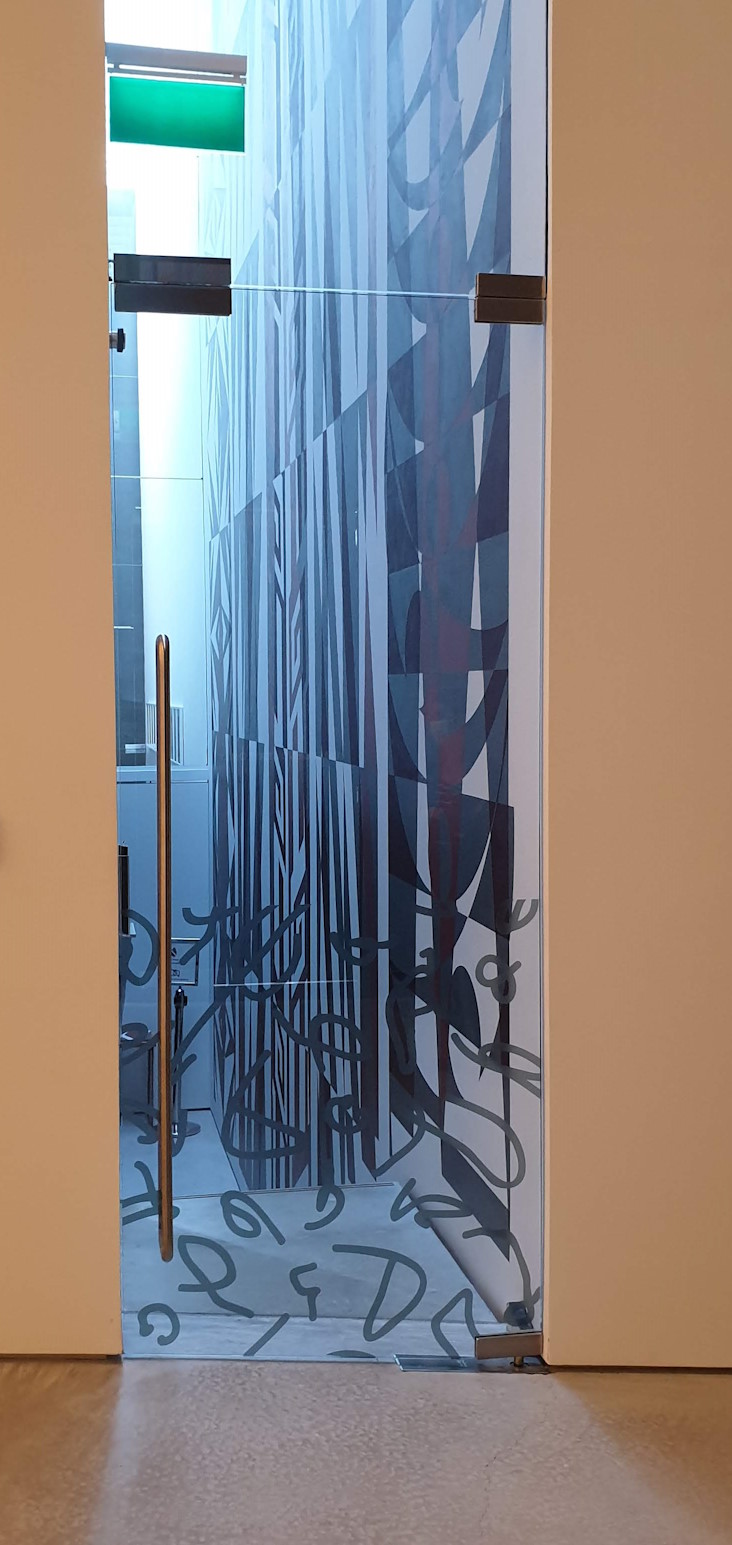 Heavy glass door that required a lock to correct misalignment at closing