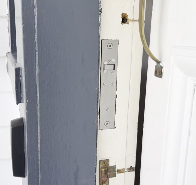 A completely concealed installation of a wooden residential front door