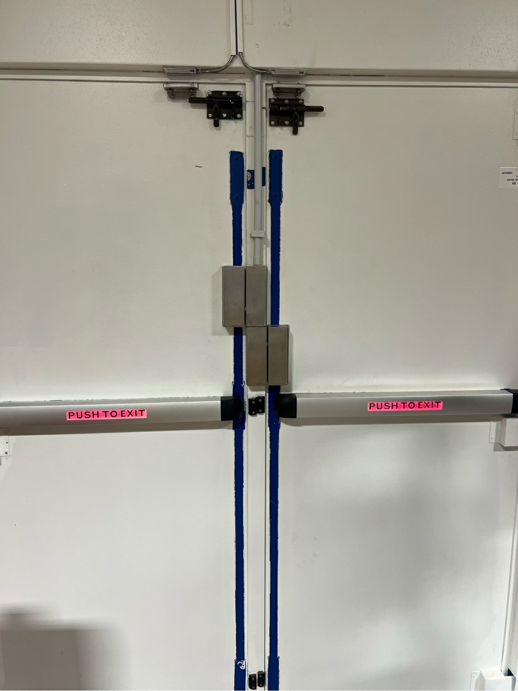 Locks added to each exit door in this warehouse installation