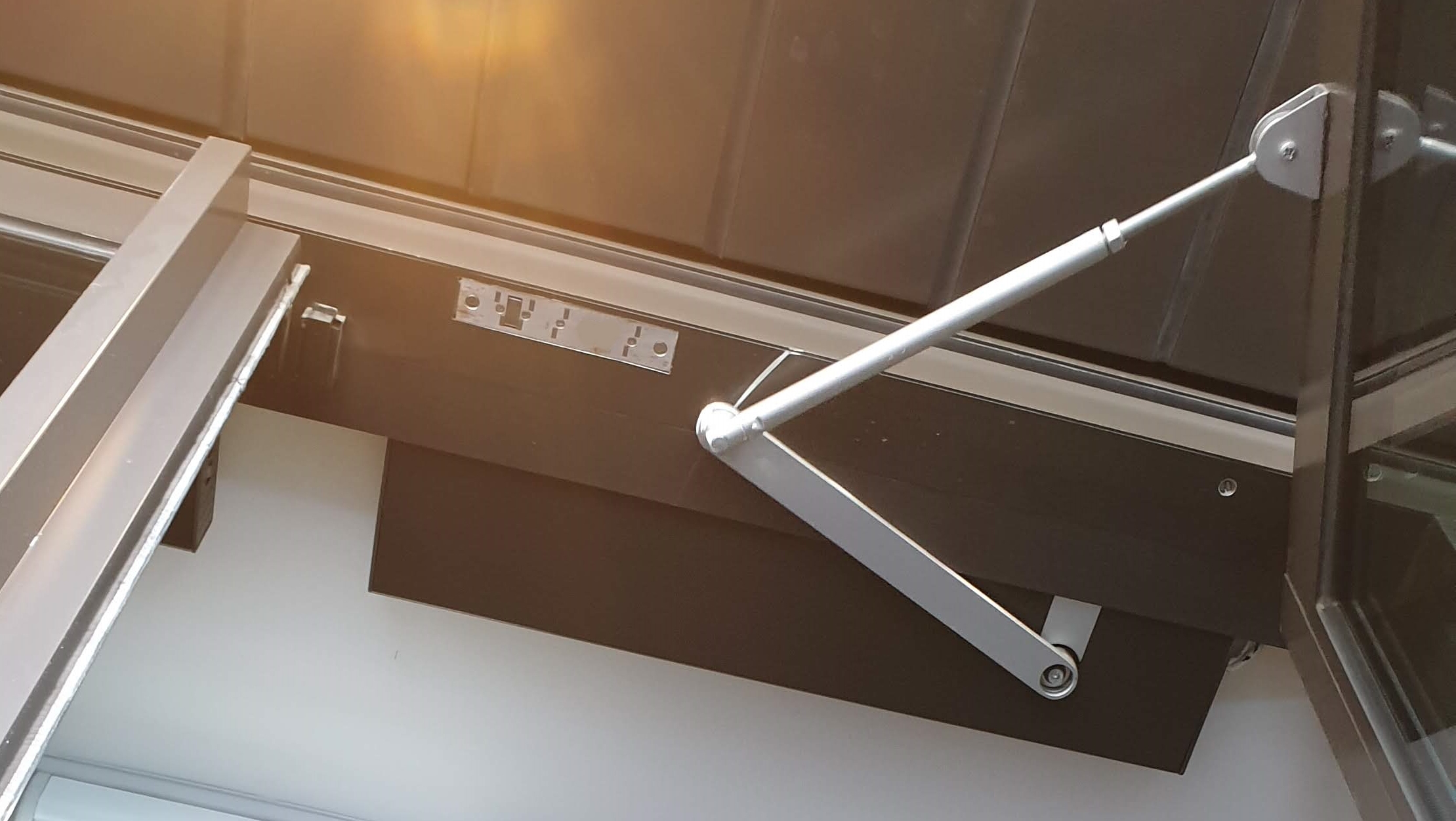 The doors weather dictated the need for a lock that could pull the door in tight when it closed