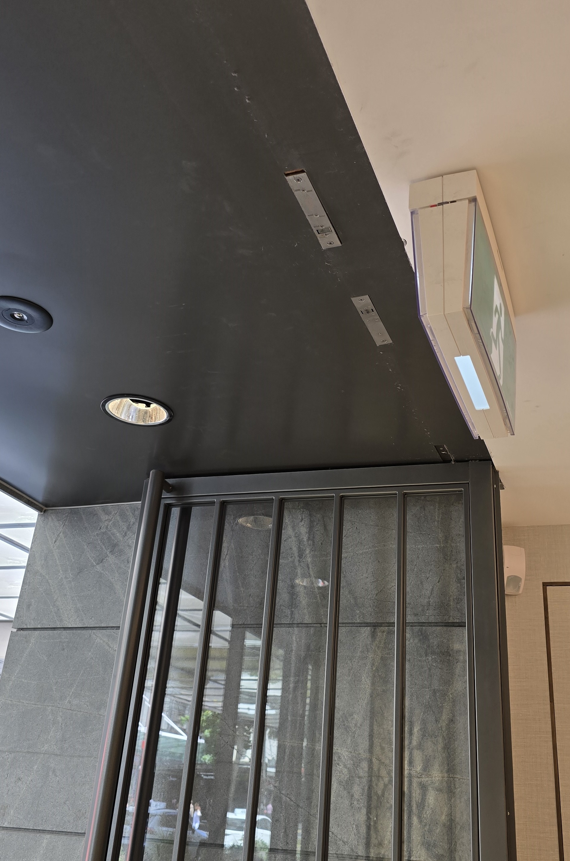 High end watch store with discreet overhead installation of the locks