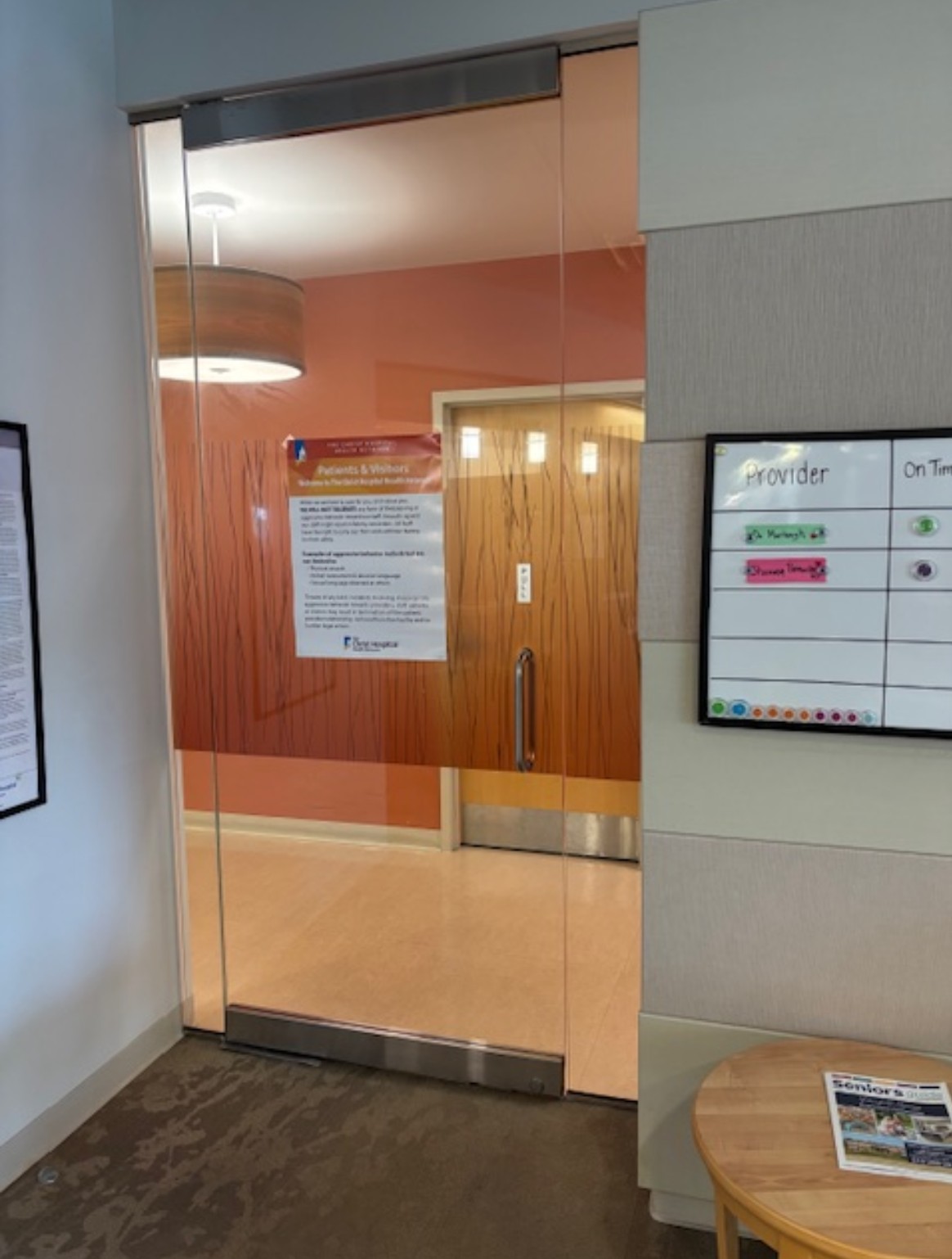 Glass door with narrow header in a medical environment