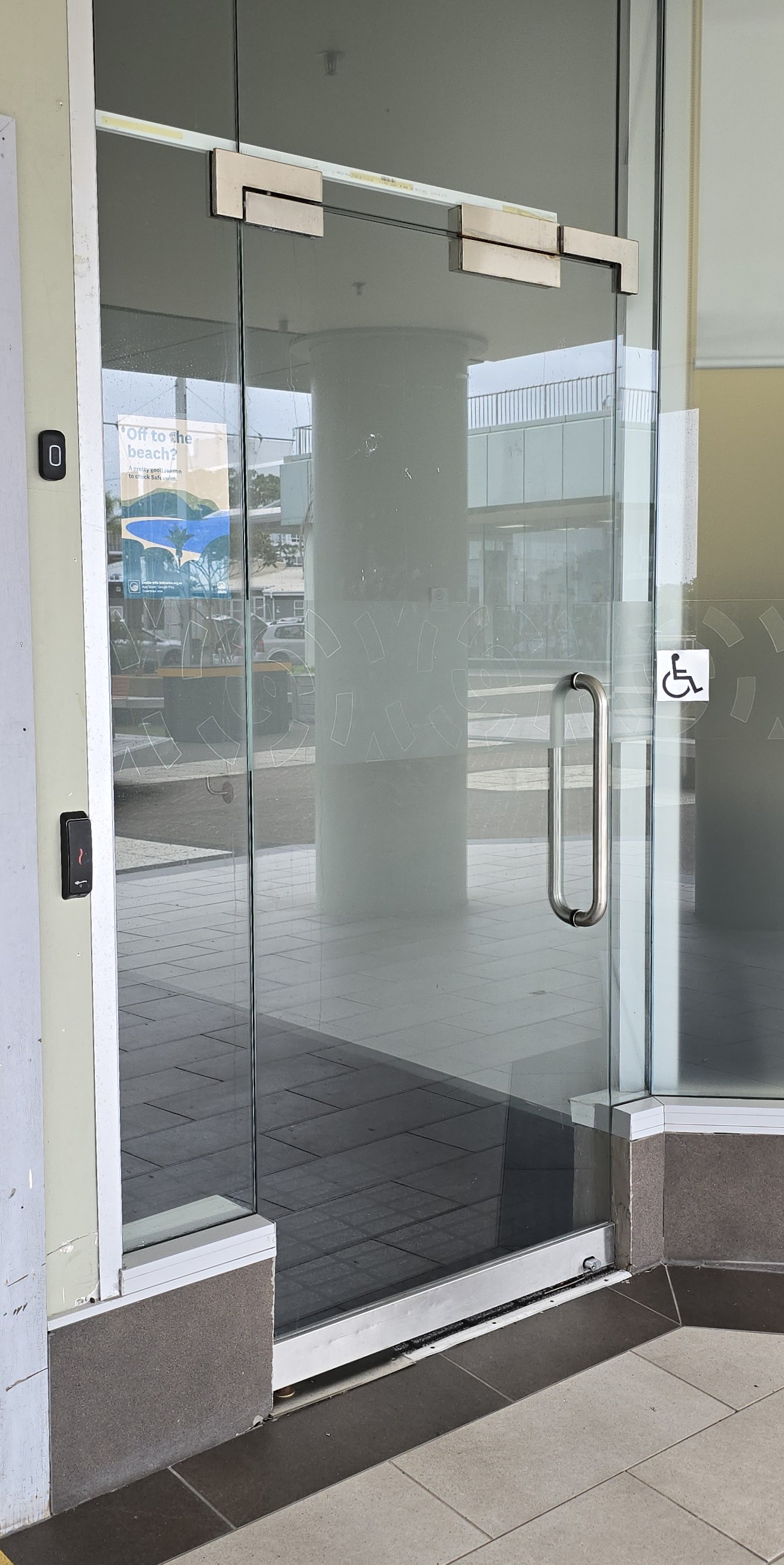 Clean addition of access control to this swing through glass door.